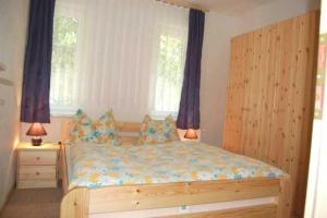 Postel nebo postele na pokoji v ubytování Ferienhaus 1 _ Ferien im Gutspark