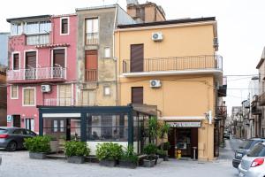 a group of buildings on a city street at B&B Agorà in Naro