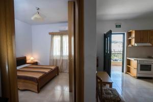 Postel nebo postele na pokoji v ubytování Thalami Apartment