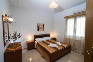 Postel nebo postele na pokoji v ubytování Thalami Apartment