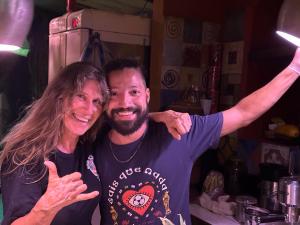 a man and a woman posing for a picture at Mais Que Nada Itacaré - Hostel, Bar & Breakfast in Itacaré