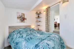 Postel nebo postele na pokoji v ubytování Querry Pigeon - maeva Home - Maison 3 pièces 6 personnes spacieuse - Prestige - Super Home MAE-8904