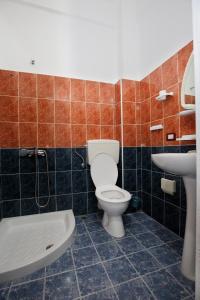 Koupelna v ubytování HotelGodini