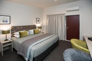 Postel nebo postele na pokoji v ubytování Pedlars Motel + 8 fotografií