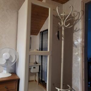 a door leading into a room with a fan at Kotimajoitus Noora in Pori +55 photos