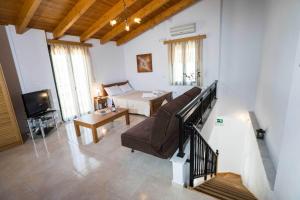 Postel nebo postele na pokoji v ubytování Thalami Apartment