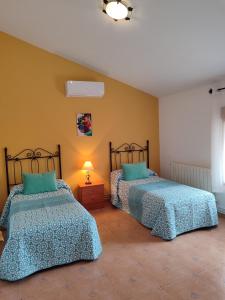 Posteľ alebo postele v izbe v ubytovaní Vivienda Rural Belén