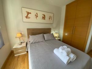 Posteľ alebo postele v izbe v ubytovaní Fantástico Playa Lérez Riás Baixas 2