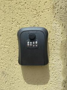 a black electrical outlet on the side of a wall at Ca del Sole - FREE Parking in La Spezia