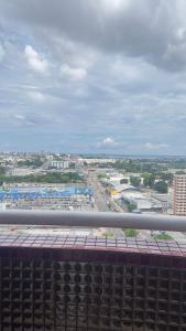 a view of a city from a balcony at Flat Manaus Hotéis Millenniun in Manaus