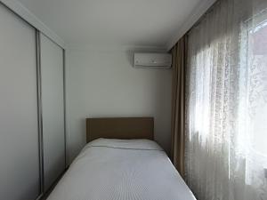 Ένα ή περισσότερα κρεβάτια σε δωμάτιο στο Mini home