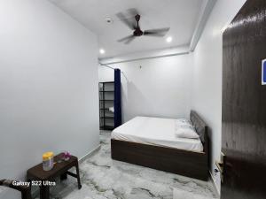 Voodi või voodid majutusasutuse Raghubir Nikunj Homestay toas