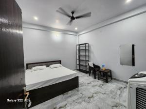 Voodi või voodid majutusasutuse Raghubir Nikunj Homestay toas