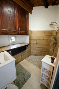 a small kitchen with a sink and a counter at Maison de village in Montcabrier