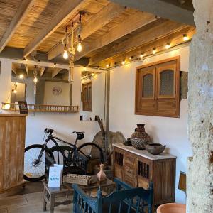 a room with a bike on the wall and a table at Amuya Hostel in Chiquinquirá