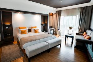 Letto o letti in una camera di DWO Mira Palace