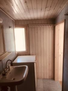 a small bathroom with a sink and a sinkessment at Barreira Beachfront Rooms 6 in Kalamata