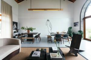 a living room with a couch and a table at Pico do Refúgio - Casas de Campo in Ribeira Grande