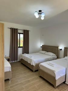 Postel nebo postele na pokoji v ubytování Niki Apartments