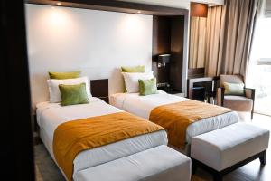 Letto o letti in una camera di DWO Mira Palace