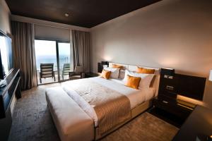 Letto o letti in una camera di DWO Mira Palace