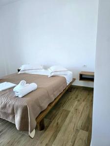Postel nebo postele na pokoji v ubytování Ambelas Getaways