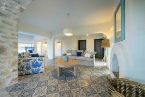 a living room with a couch and a table at Alya Country in Turunc