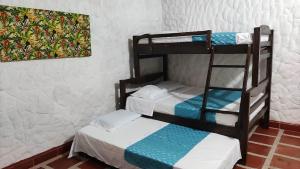 Ένα ή περισσότερα κρεβάτια σε δωμάτιο στο Cabañas Pork Light