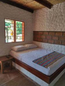 Ένα ή περισσότερα κρεβάτια σε δωμάτιο στο Cabañas Pork Light