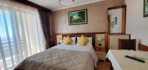 Postel nebo postele na pokoji v ubytování Hotel Panorama Dajt