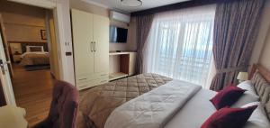 Postel nebo postele na pokoji v ubytování Hotel Panorama Dajt