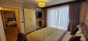 Postel nebo postele na pokoji v ubytování Hotel Panorama Dajt