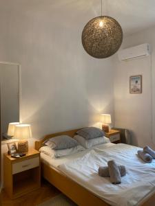 En eller flere senge i et værelse på Maison Riviera Opatija