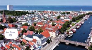an overview of a city with a river and buildings at Ferienwohnung Am Strom in Warnemünde