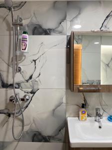 a bathroom with a shower and a sink at Vila Katalea in Gjirokastër +253 photos