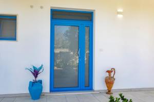 a blue door on the side of a house at Villa Rebecca in Nardò