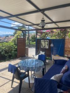 a patio with a table and chairs and a view at Apartments Villa Dinka in Opatija