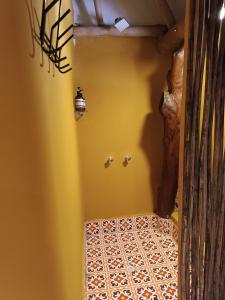 a hallway with a tiled floor in a house at Kite Eco House Salinas del rey in Salina de Rey