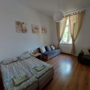 Łóżko lub łóżka w pokoju w obiekcie Apartament Parkowy