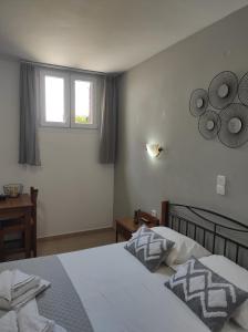 Postel nebo postele na pokoji v ubytování Vythos
