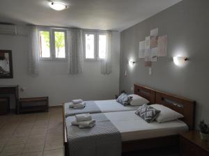 Postel nebo postele na pokoji v ubytování Vythos