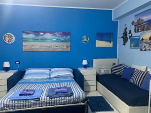 A bed or beds in a room at Casa Limoni al mare tra Catania Etna e Taormina