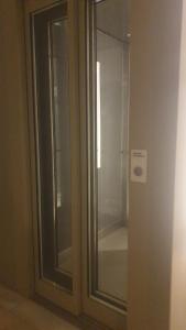 a glass door with a window in a room at Puerto marina in Benalmádena +12 photos