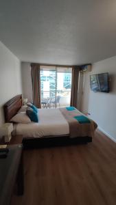 Ein Bett oder Betten in einem Zimmer der Unterkunft Apart Lyon Suite