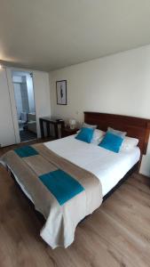 Ein Bett oder Betten in einem Zimmer der Unterkunft Apart Lyon Suite