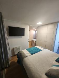 Ein Bett oder Betten in einem Zimmer der Unterkunft Apart Lyon Suite
