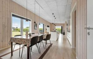 a kitchen and dining room with a table and chairs at Pet Friendly Home In Hemmet With Wifi in Hemmet