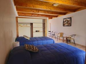 Postel nebo postele na pokoji v ubytování Hostal Belen