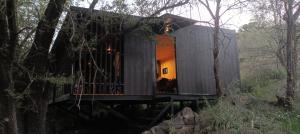 a tree house in the middle of a forest at Casita en el río, Mayu Sumaj in San Antonio de Arredondo +3 photos