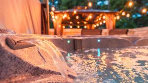 a pool of water with a table in the background at 5 mins to Speedway! Walk to Zoo, WR park, IUPUI! in Indianapolis